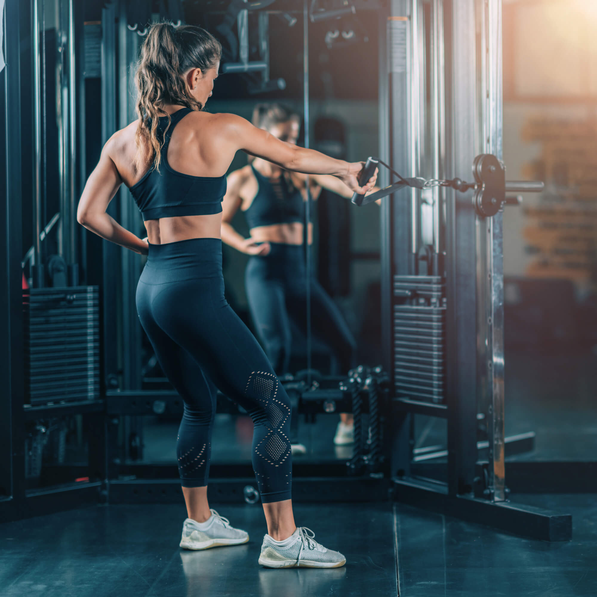 woman-doing-exercise-on-a-machine-in-a-gym-2023-11-27-05-18-40-utc.jpg